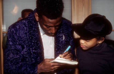 Big Daddy Kane signs an autograph for a fan when he appears at a - Old Photo