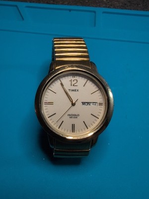 Timex Mens Indiglo Gold/White Face Day/Date Watch WR30M Cell Stainless CR2016