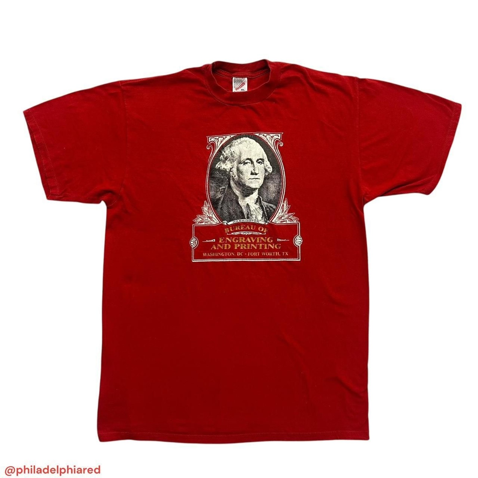 Red vintage 1990s T-shirt with U.S. Mint Bureau of Engraving and Printing seal featuring George Washington’s profile.