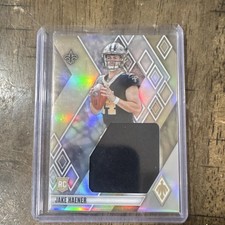 2023 Panini Phoenix Jake Haener Rookie Memorabilia Card New Orleans Saints. rookie card picture
