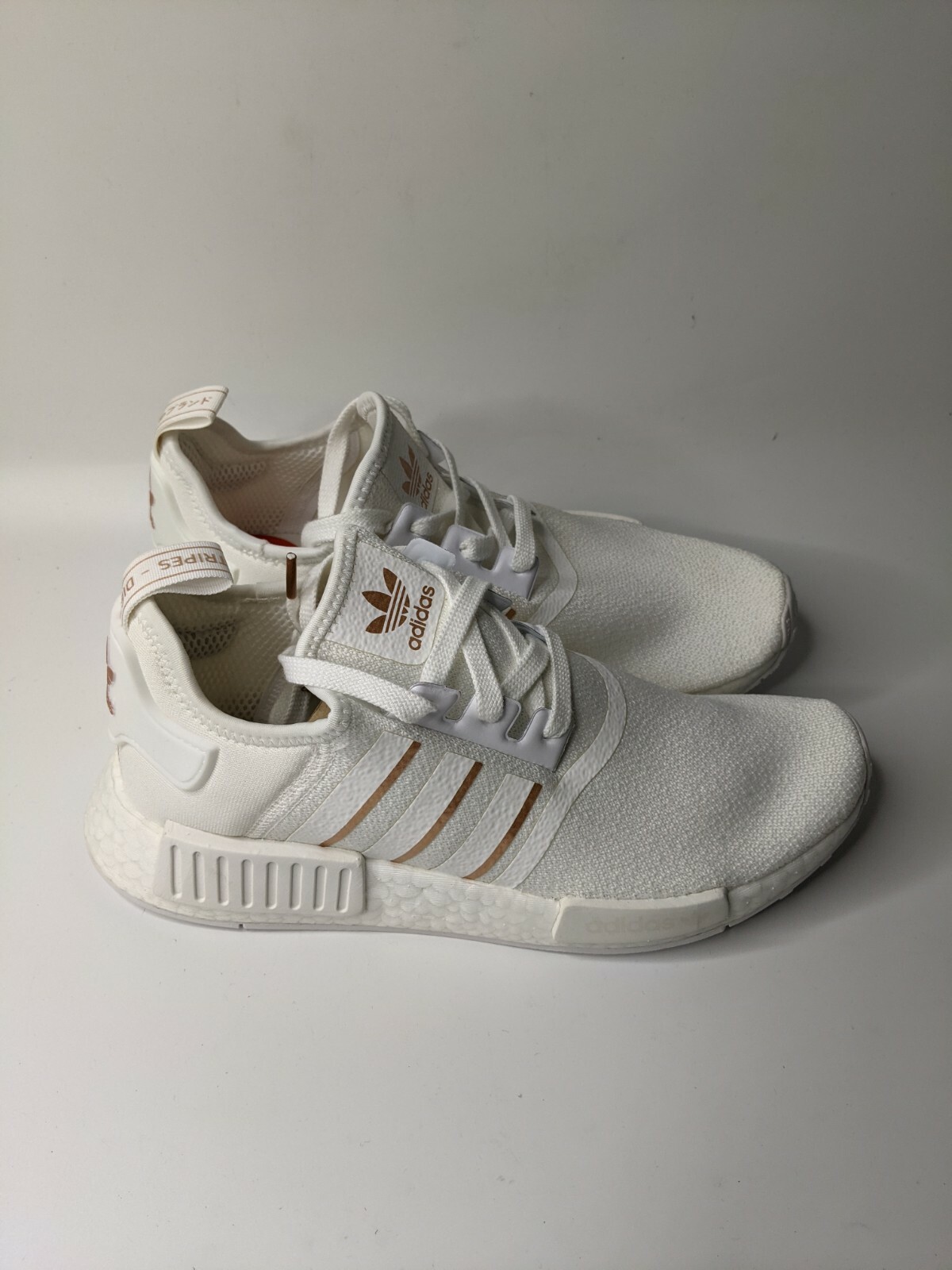 white nmds with rose gold