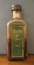 Vintage Singer Co. Sewing Machine Oil Embossed Glass Bottle 3oz. PARTIALLY FULL