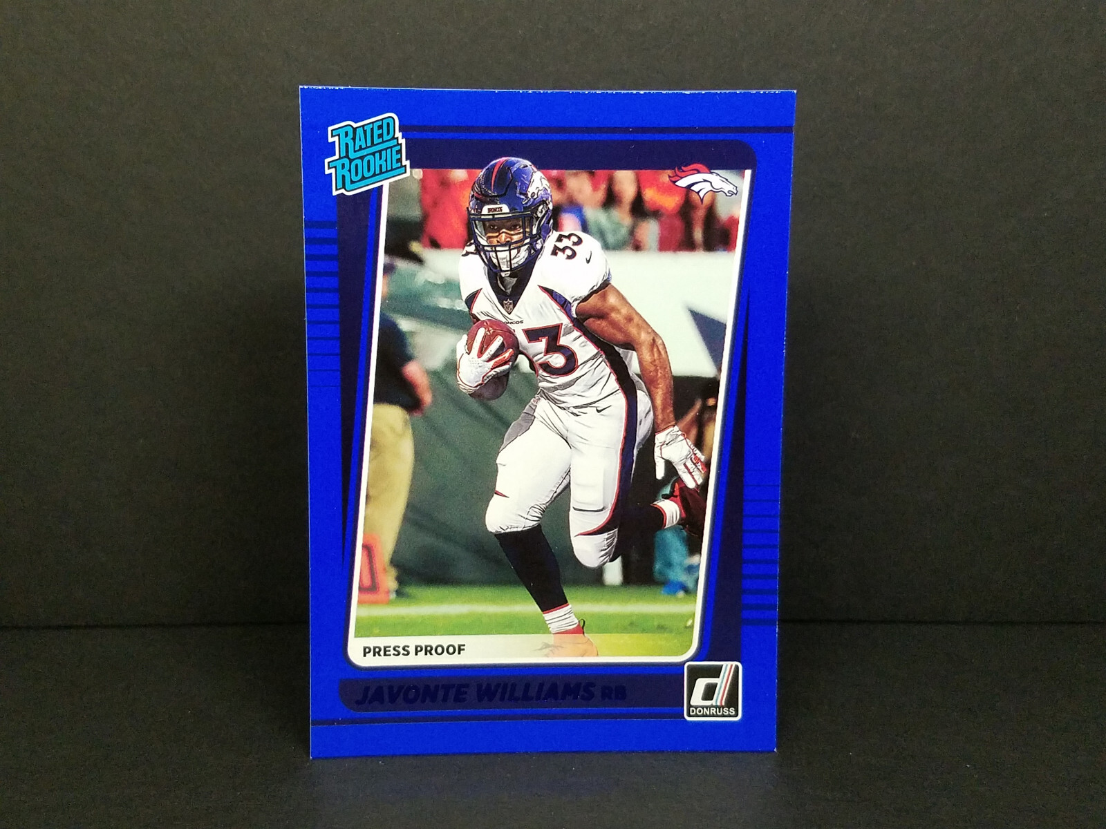 2021 Panini Donruss 275 Javonte Williams, Broncos (RC) Press Proof Blue Parallel