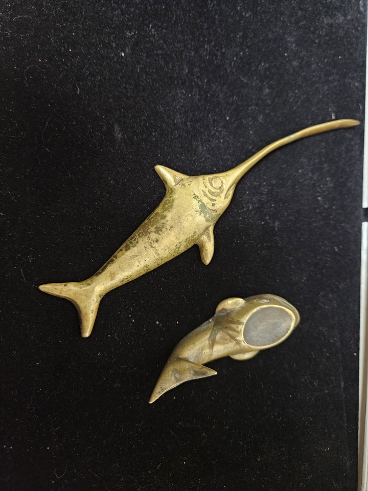 A brass swordfish letter opener paired with a matching trinket ashtray — a wildly specific MCM set that is pure conversation-starter energy.