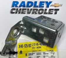 NEW GM OEM CHEVY HEADLAMP- FRONT LAMPS- HEADLAMP ASSEMBLY BRACKET LEFT 23164206