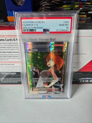 The Pokémon Company Brigette Trainer 161/162 Full Art Holo EN PSA 10