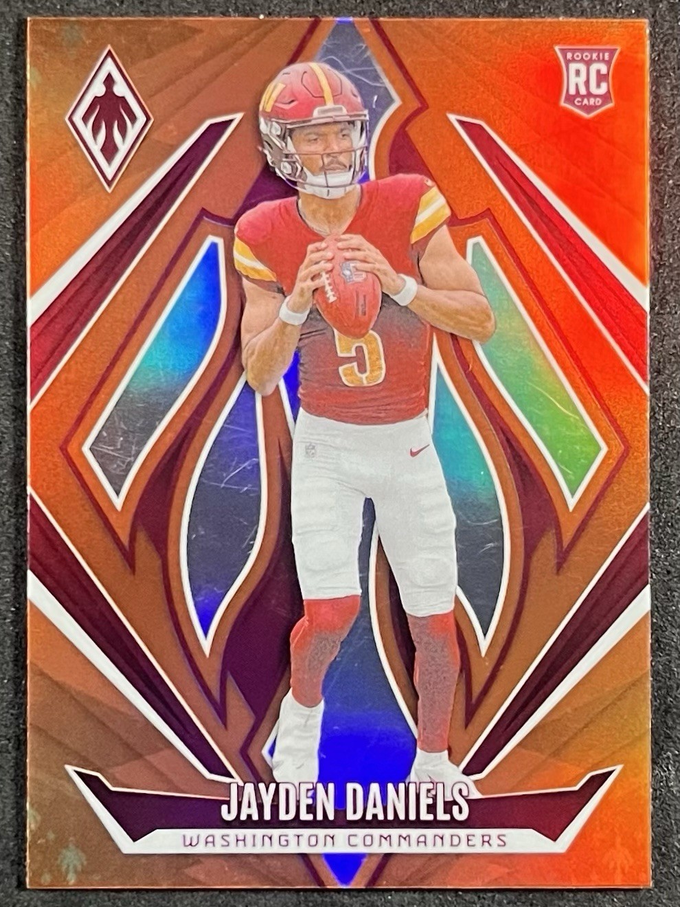 Jayden Daniels 2024 Panini Phoenix Orange (RC) - Commanders #198