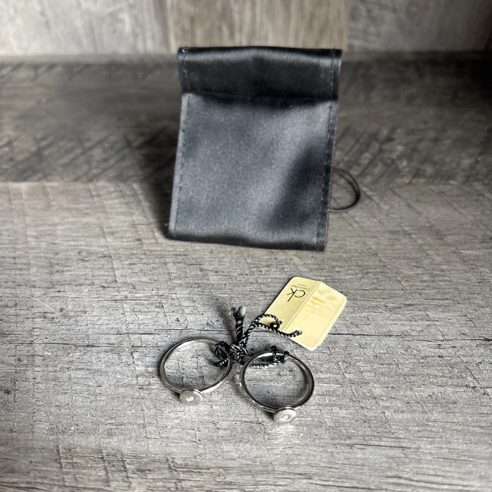 CK Calvin Klein 2 anillos de acero inoxidable tono plata talla 7 joyería para mujer #120 Foto 2 de 4