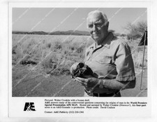 o66718 1980's orig photo Walter Cronkite w human skull documentary TV Ape Man or