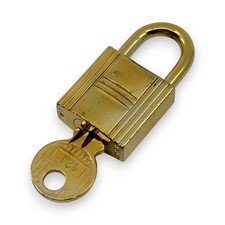 Set lucchetto e chiave Hermes Cadena tono oro pj260113