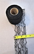 Black lace, 2.5" W x 23 yards L, some stretch, raw edges, floral mesh polyester