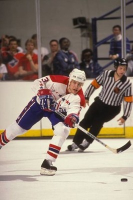 Scott Stevens Washington Capitals passes off the puck during a NHL- Old Photo