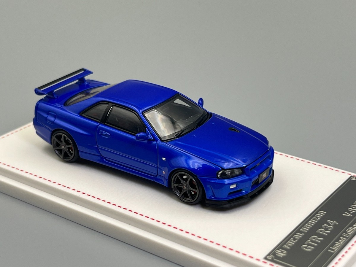 イグニッションモデル1/64　SKYLINE　R34 GT-R V−SpecⅡ Nissan Skyline GT-R R34 Bayside Blue V-Spec II Focal Horizon 1/64