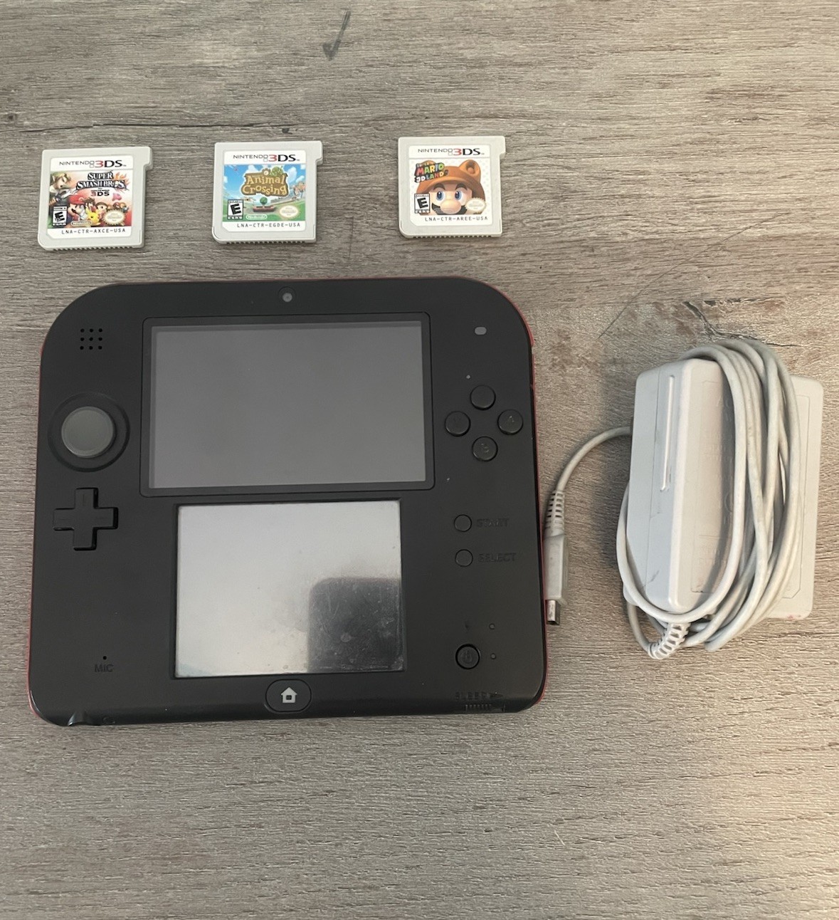 Nintendo 2DS Black Red Handheld Console w/ Charger & 3 Nintendo 3DS Games