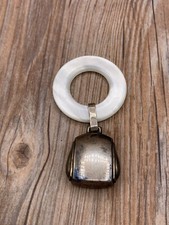 Antique synthetic mother of pearl and sterling teether rattle by webster