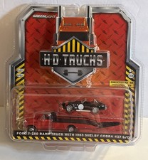 1:64 Greenlight Black Shelby Cobra 427 S/C w/ Red Ford F-350 Ramp Truck