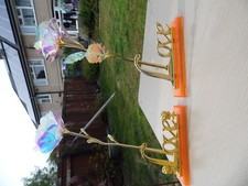 unbranded home decor "Love" signs on stands with pearlescent roses 9.5" tall