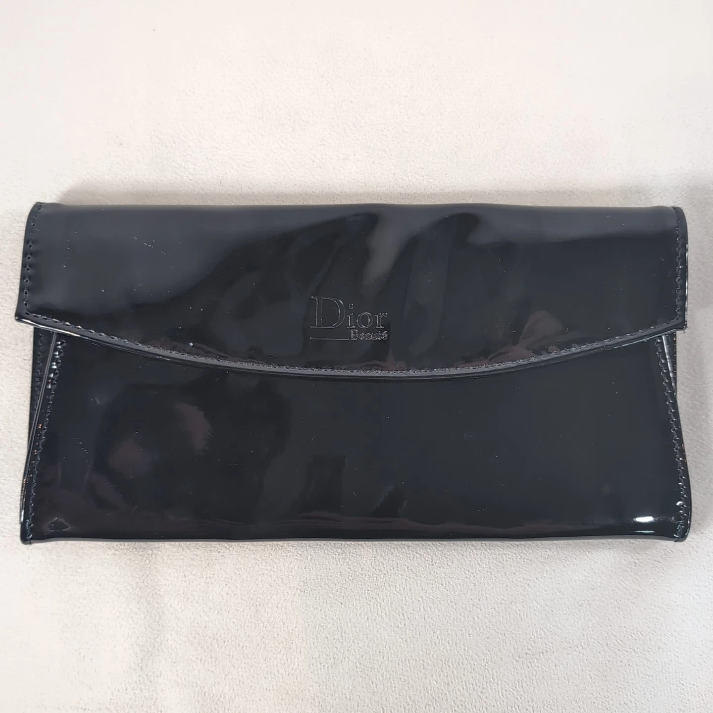 Pochette portefeuille Dior Beauty noir simili cuir verni dépliant maquillage Christian