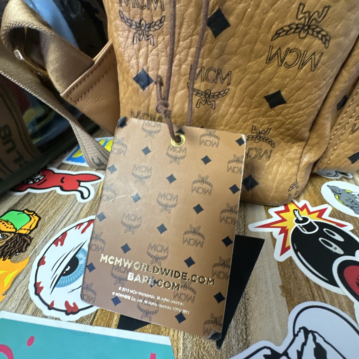 人気コラボ⭐︎BAPE x MCM⭐︎ Shark Stark Backpack MCM x BAPE Shark Stark Backpack Visetos Cognac – Hype Vault