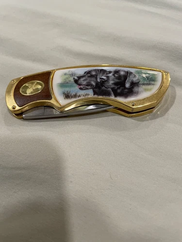 Franklin Mint folding Knife with two black labs.  The knife was never used 
