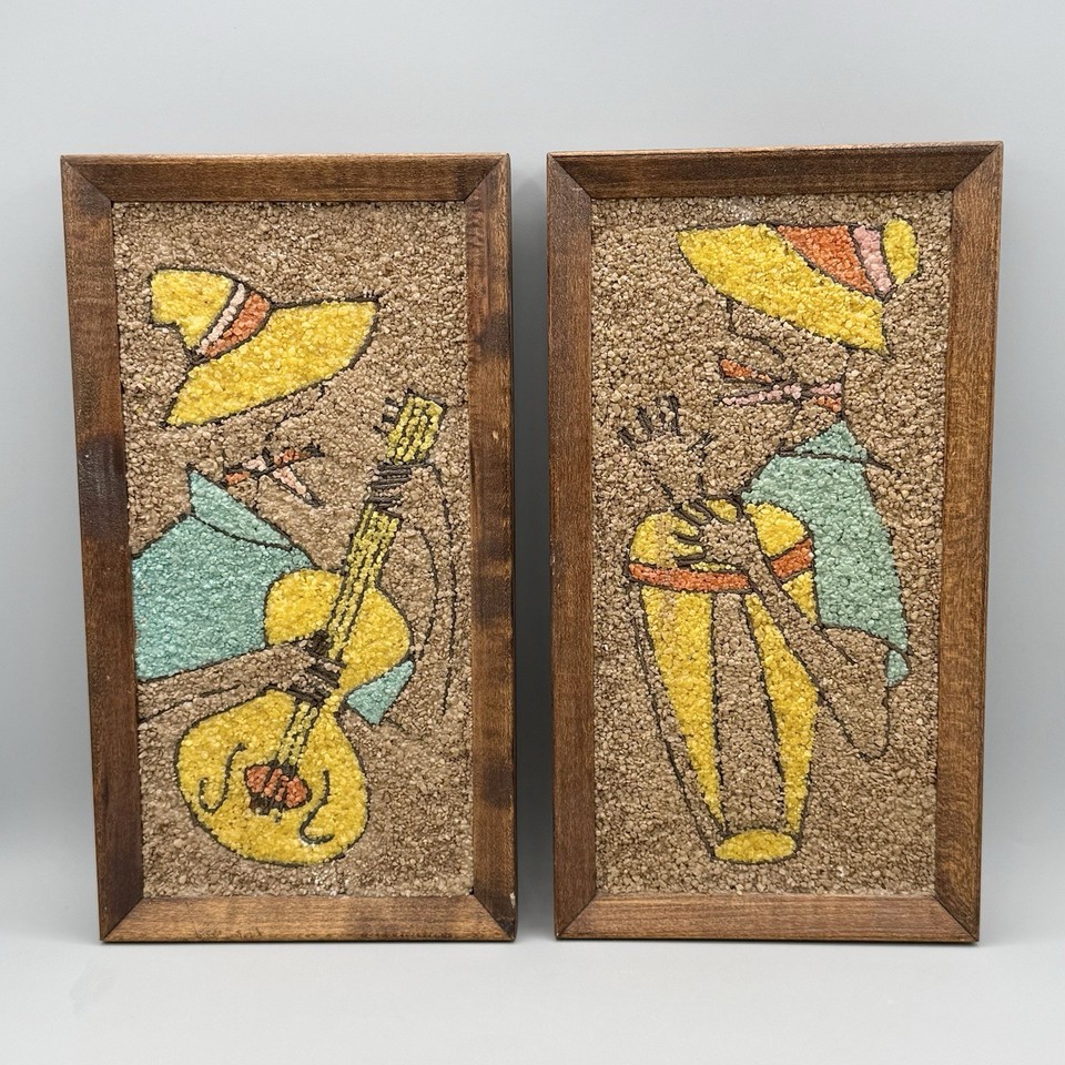 A matched set of two mid-century pebble art and calypso musician wall hangings — tactile, handcrafted, and deeply 1960s-cool.