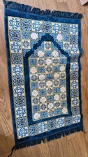 Turkish velvet prayer mat featuring intricate geometric arabesque designs and...