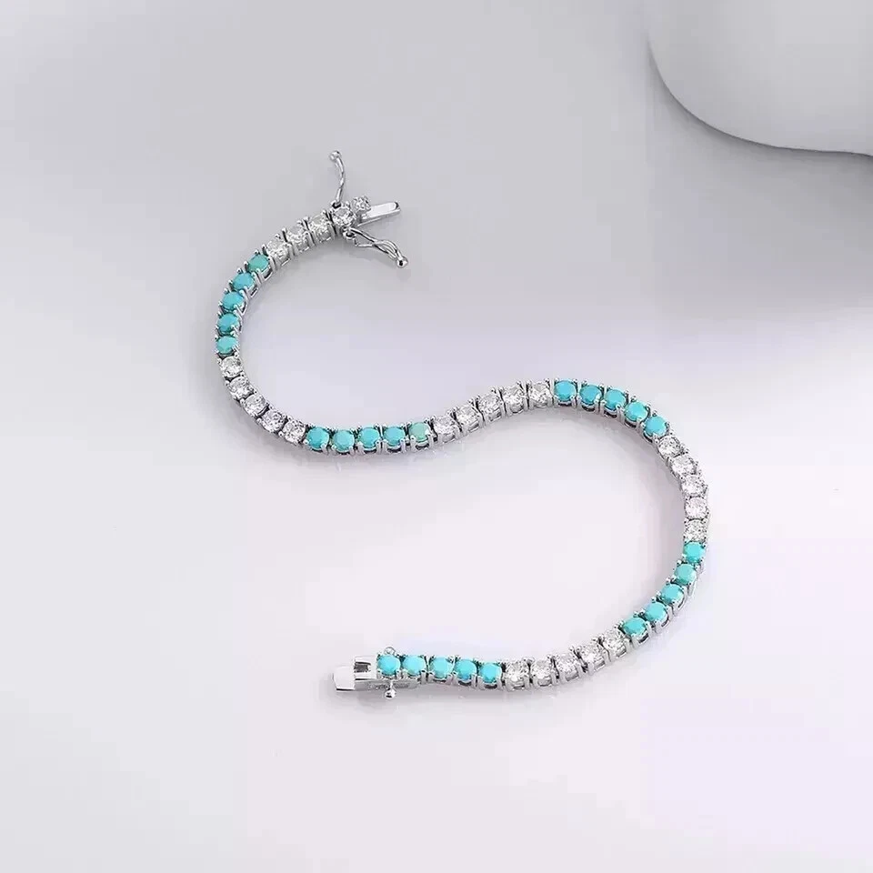 Brazalete de tenis turquesa/diamante creado en laboratorio de corte redondo de 4 mm de oro blanco de 14 K Foto 2 de 4