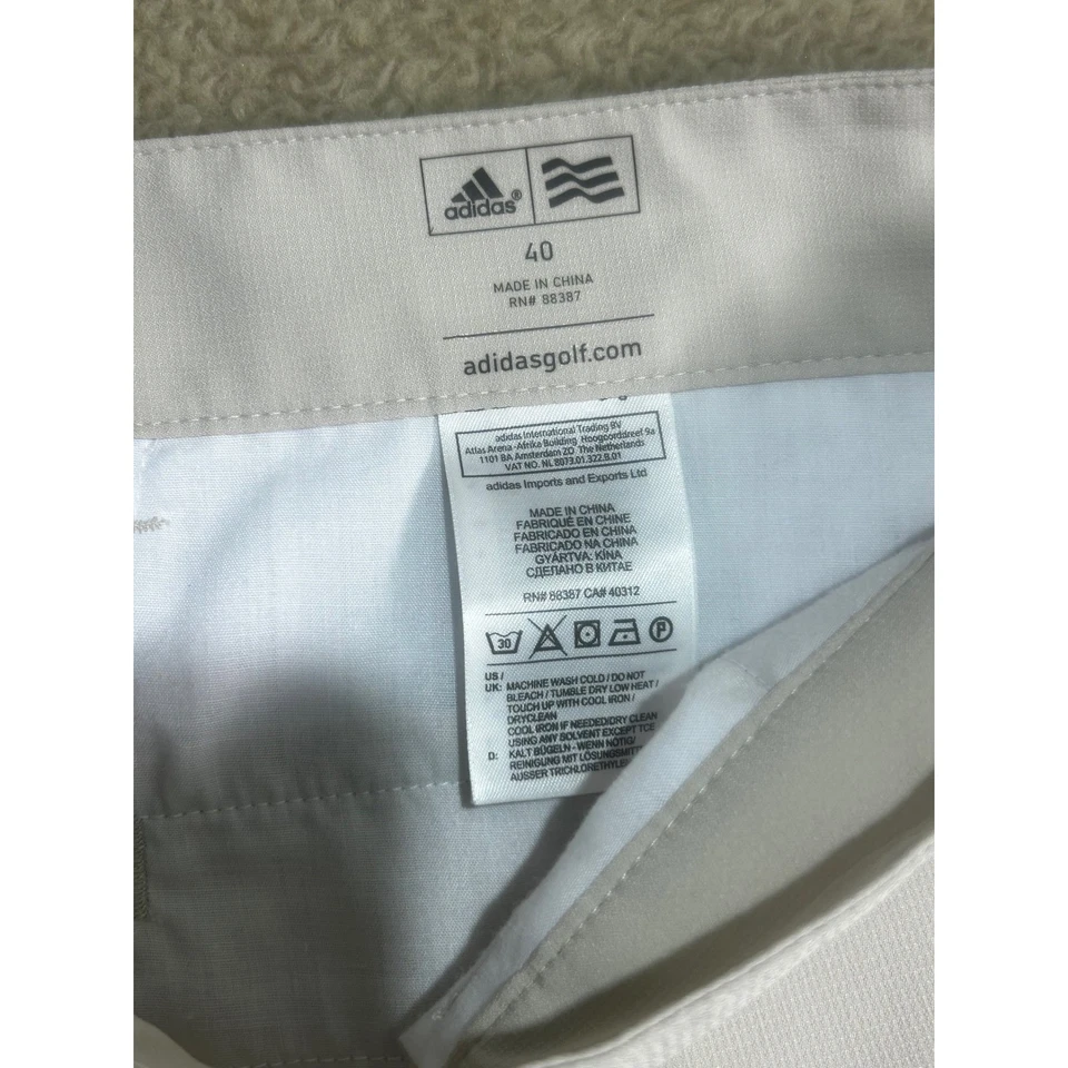 Pantalones Cortos de Golf Adidas Para Hombre 40 Beige Frente Plano Rendimiento Elástico Chino Foto 4 de 4