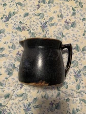 Vintage  Stoneware dark brown glaze pitcher with cream interior