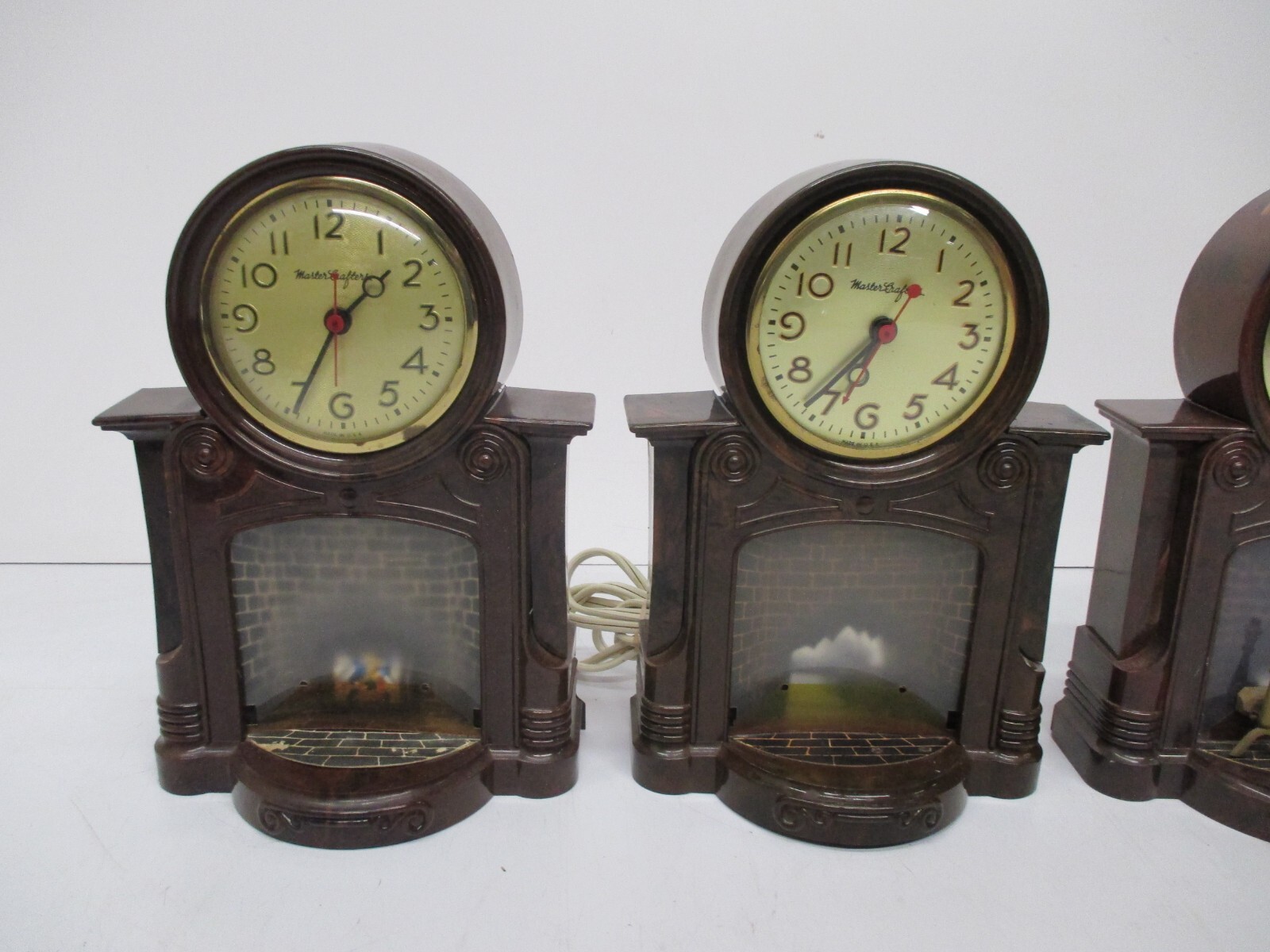 Lot 4 Vtg MasterCrafters Fireplace Motion Light Up Mantle Table Clocks