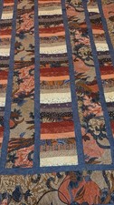 Decorative quilt featuring a batik-style pattern in shades of many colors-70x70