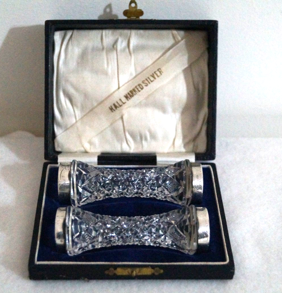 Sterling silver rimmed cutlery rests, cut glass, boxed. London 1927