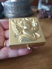 Embossed gold-toned metal cherub angel, rhinestone pill box