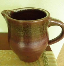 Handmade ceramic pitcher or vase rustic red browns with handle spout 5"x7 1/2"