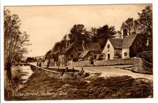An Early W. Dennis Moss "Cecily" Series Post Card of The Street, Bibury, Glos.