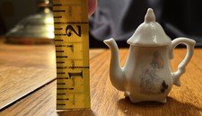Precious Moments Tea Pot Girl & Skunk Miniature