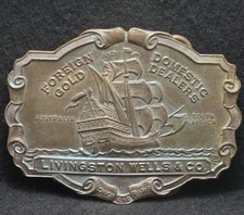 XD11140 VINTAGE 1970s LIVINGSTON WELLS CO FOREIGN GOLD DEALERS BELT BUCKLE