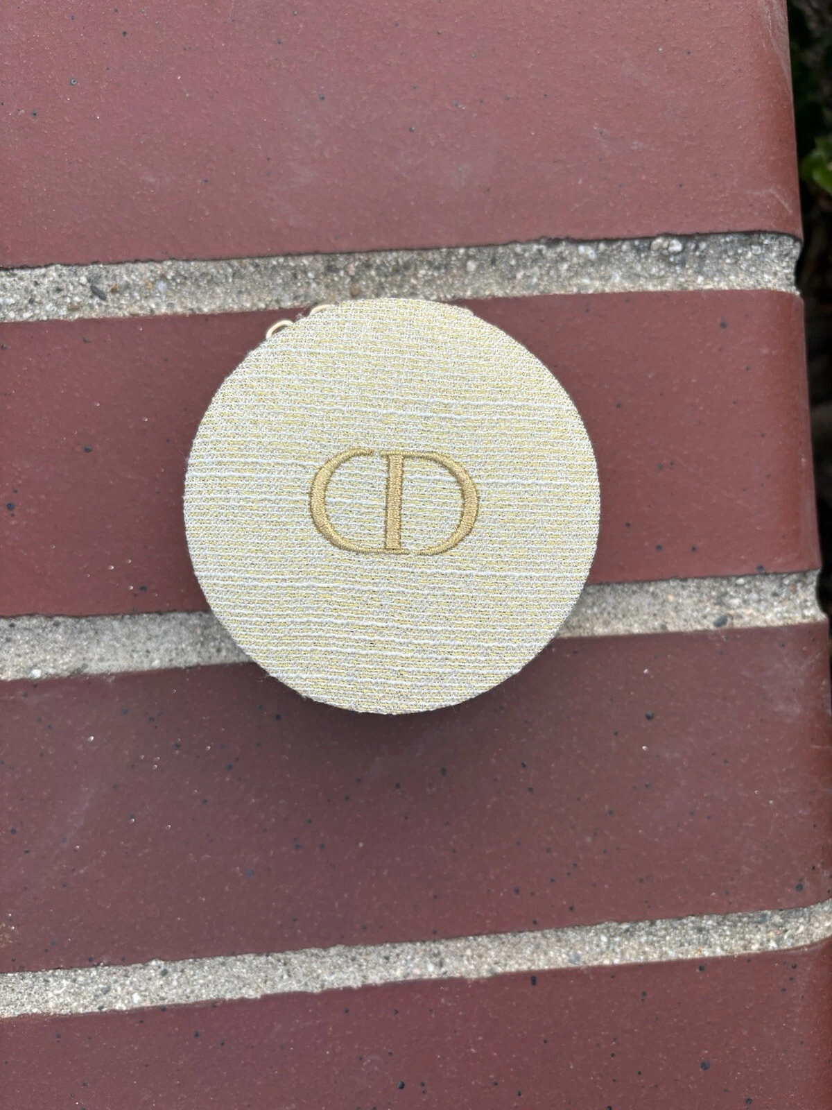 Porte monnaie rond doré Dior