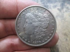 US 1878 8 TAIL FEATHERS MORGAN DOLLAR COIN IN VERY FINE CONDITION CLEANED