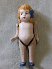 3 3/4" Bisque Girl Doll, Nude, Made in Japan, Orange hair, Blue bow and shoes — photo 1