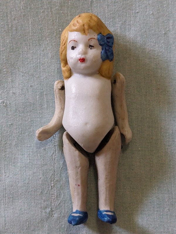 3 3/4" Bisque Girl Doll, Nude, Made in Japan, Orange hair, Blue bow and shoes