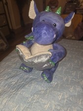 Cuddle Barn Dalton the Storytelling Dragon, an animated plush toy.