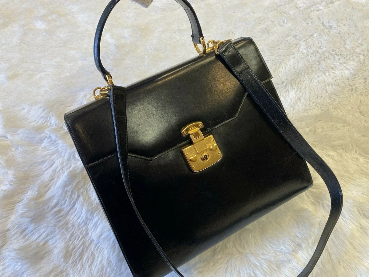 Vintage Gucci black leather shoulder bag with golden and silver