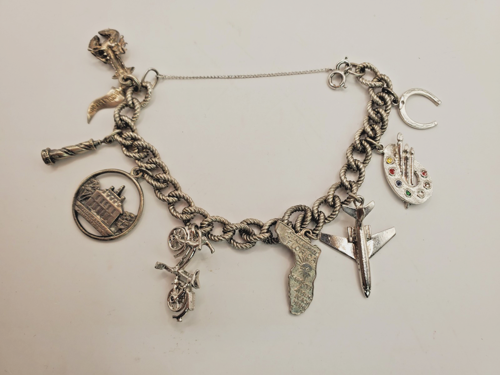 Silver tone Travel Theme Charm Bracelet Lobster Lighthouse Plane Bike Florida