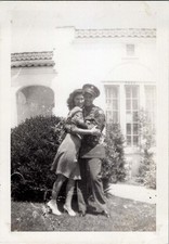 WW2 Photo of Soldier Embracing Woman by Stucco House