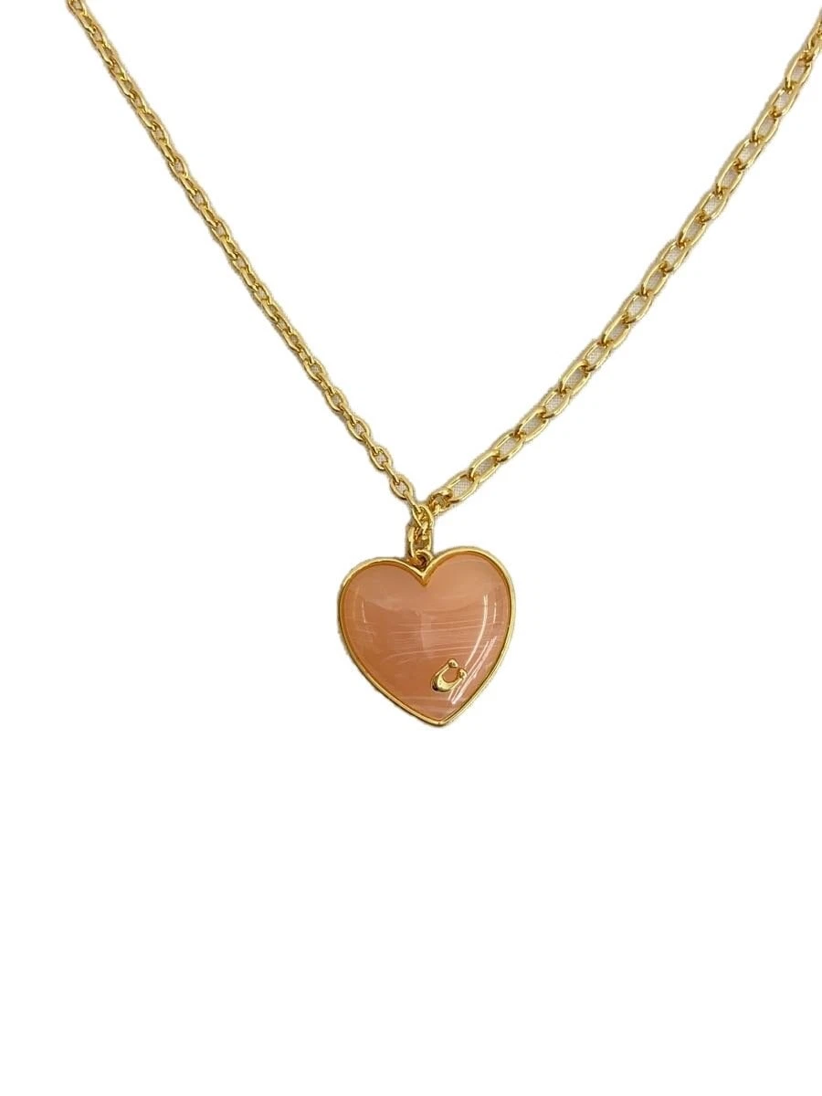 Collana COACH top GLD con donna