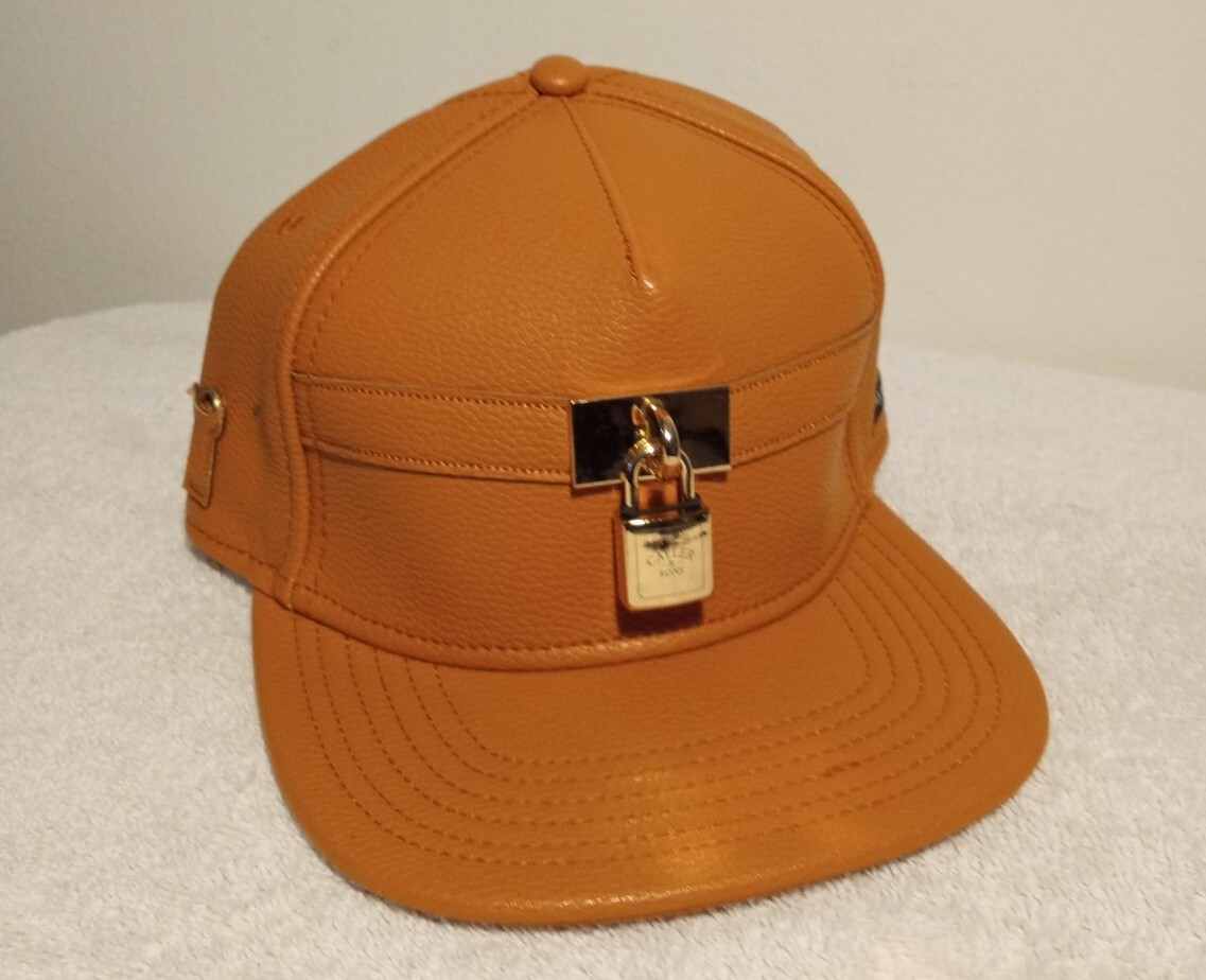 Cayler & Sons Black Label Lockdown Orange Gold Leather StrapBack Hat Metal Lock