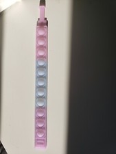 New fidget pop bracelets changes color under UV.