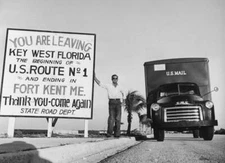 Mail van parked by sign which marks beginning of US Route 1 OLD PHOTO