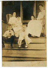 wd7 Postcard  rppc family on porch 685as